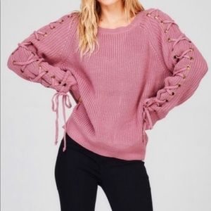 Mauve colored sweater with lace ties down the sleeves
